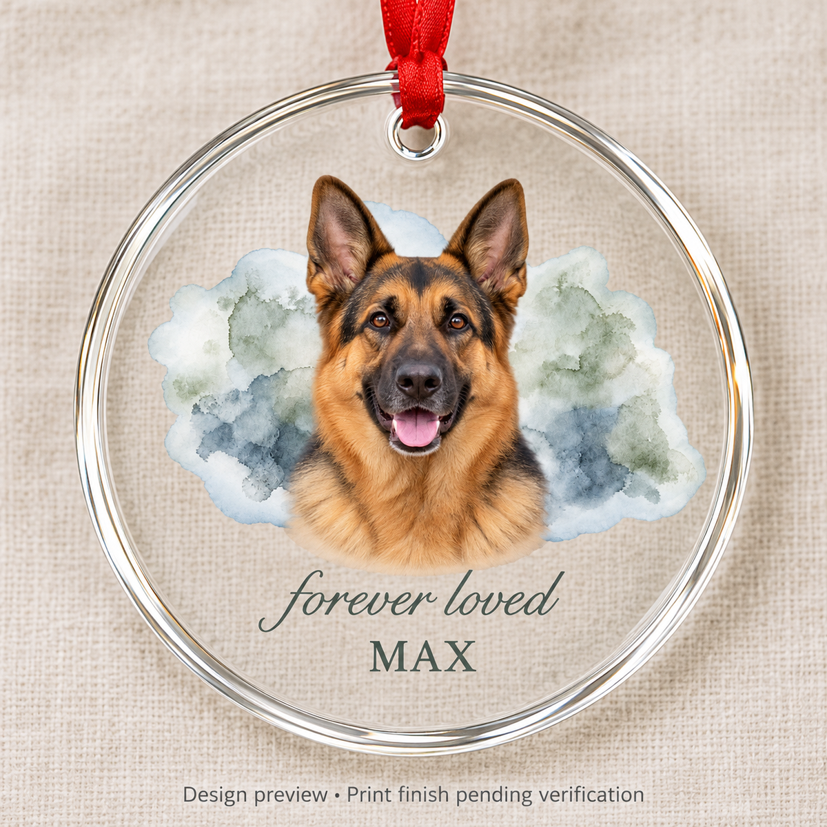 Design preview of Max German Shepherd memorial glass ornament on linen, with forever loved wording, watercolor portrait and red ribbon. Print finish pending verification.