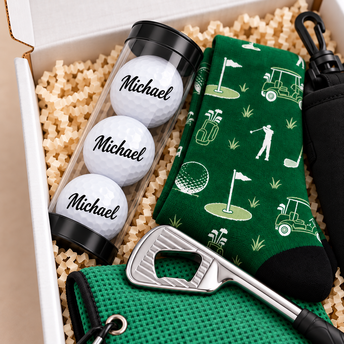 Close-up of three white golf balls personalized with the name Michael in matching black script